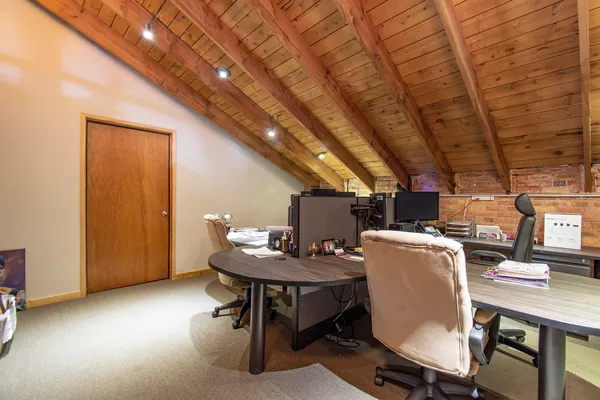 a workspace with furniture and a table