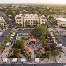 an aerial view of residential building with green space
