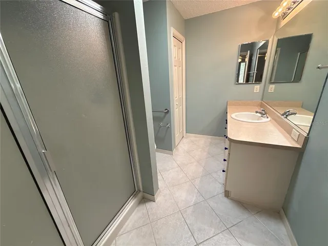 a bathroom with a sink toilet and mirror