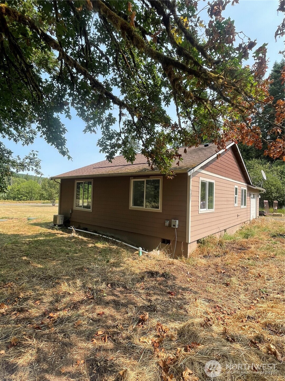 397 Bunker And 0 Bunker Road Chehalis, WA 98532 - Photo 18 of 20 a front view of house with yard and trees