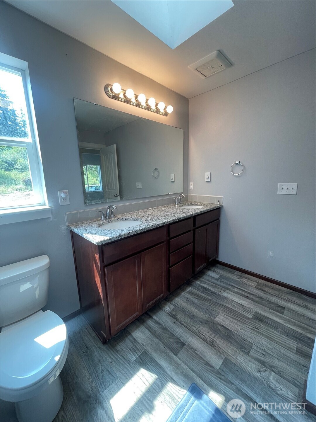 397 Bunker And 0 Bunker Road Chehalis, WA 98532 - Photo 9 of 20 a bathroom with a granite countertop toilet sink and mirror