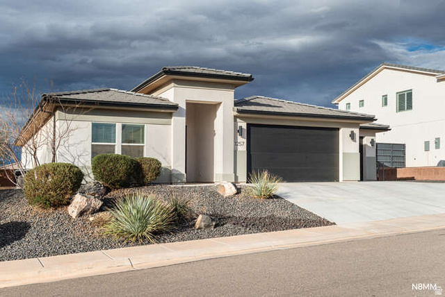 1257 Marlberry Way Washington, UT 84780 - Photo 1 of 1 Prairie-style home with a garage, concrete driveway, and stucco siding