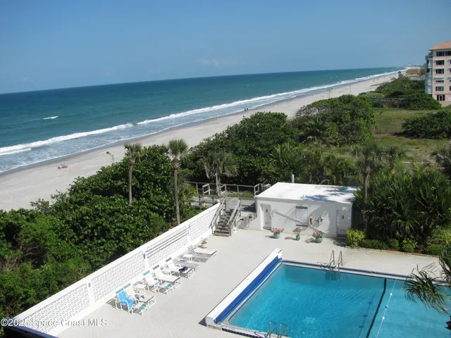 a view of a tennis ground with a large window