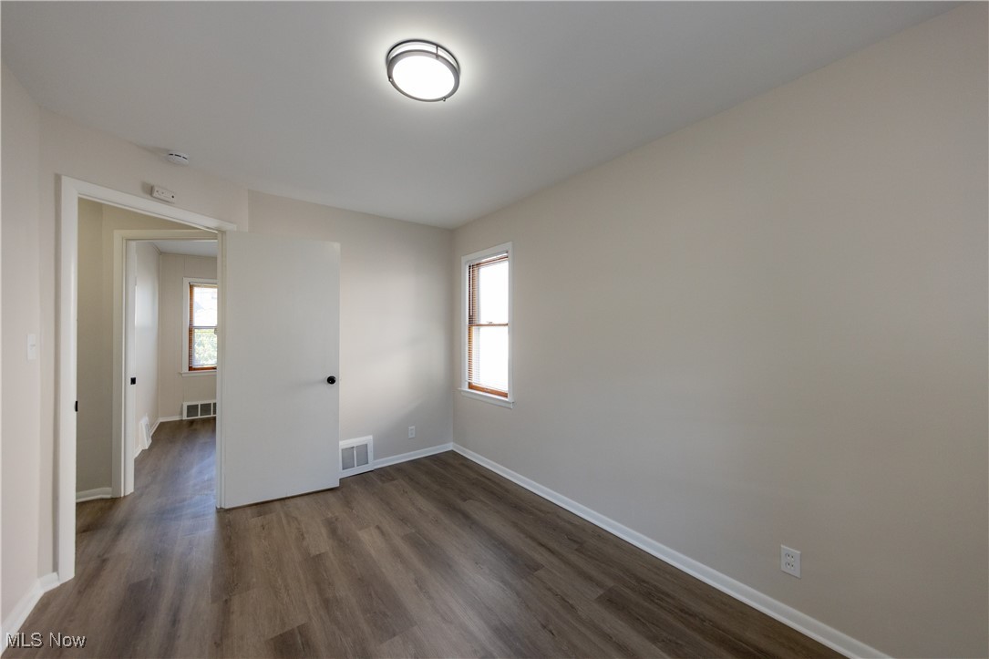 29103 Barjode Road Eastlake, OH 44095 - Photo 6 of 31 Empty room featuring dark wood-type flooring and plenty of natural light