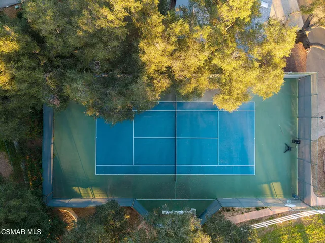 a view of a swimming pool with chairs