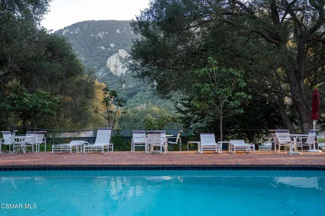 a view of a brick house with a porch