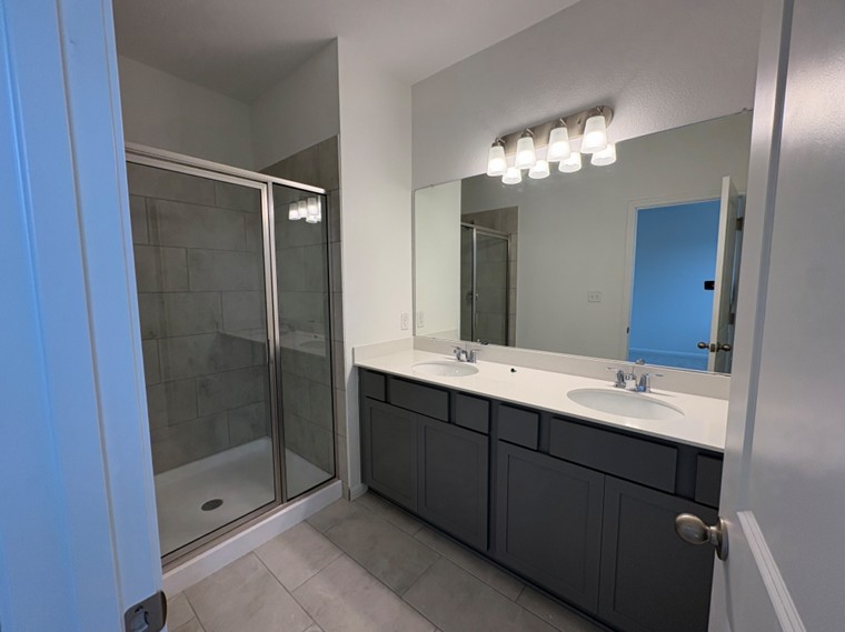 103 Cherry Blossom Lane Taylor, TX 76574 - Photo 12 of 22 Primary Bath retreat with dual vanities & walk-in shower