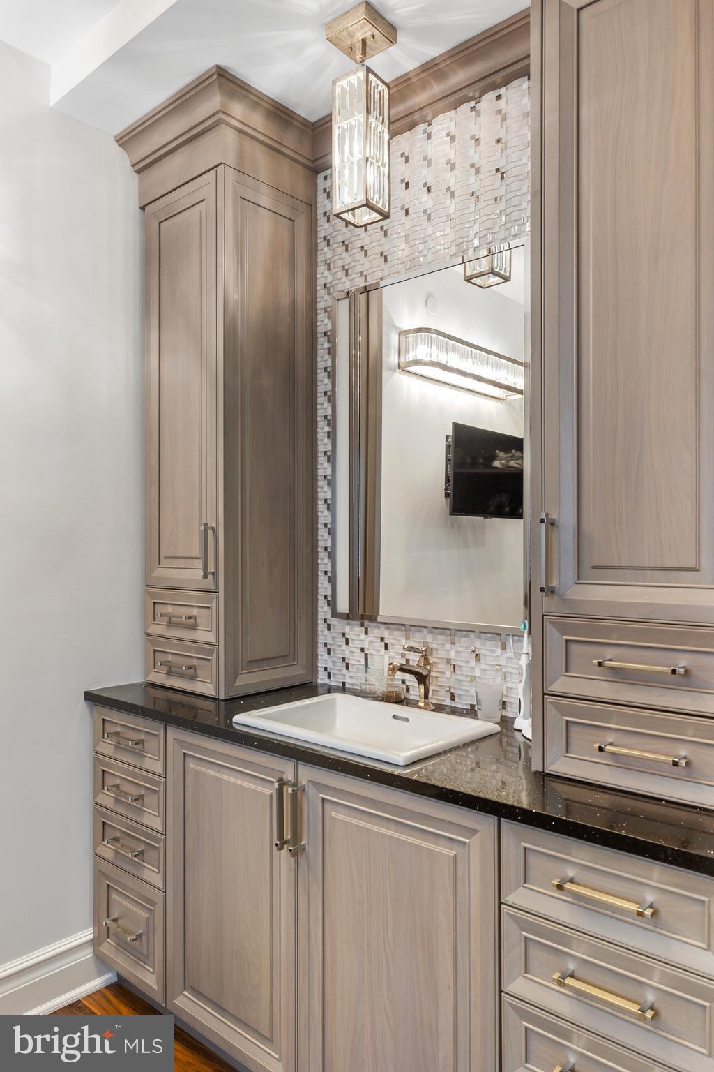 2801 Riverton Road Cinnaminson, NJ 08077 - Photo 36 of 57 a bathroom with a sink and a mirror