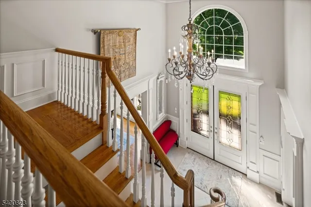 a view of an entryway with wooden floor