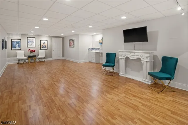 a view of a livingroom with furniture and a flat screen tv