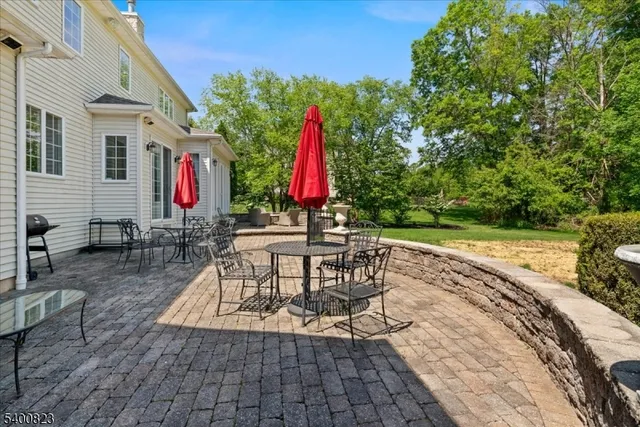 a view of a backyard with sitting area