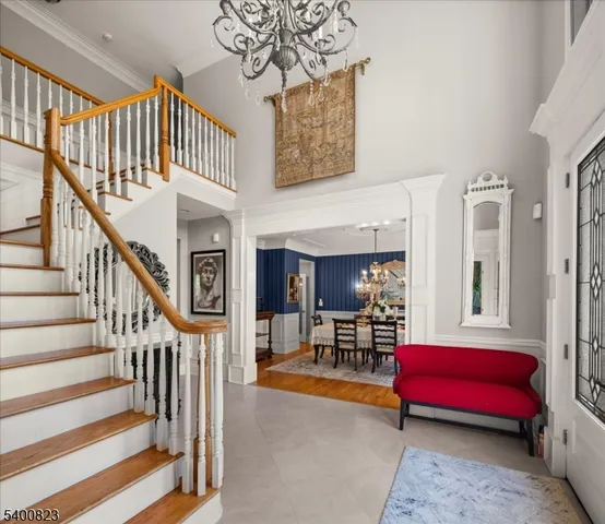 a bedroom with furniture and a chair