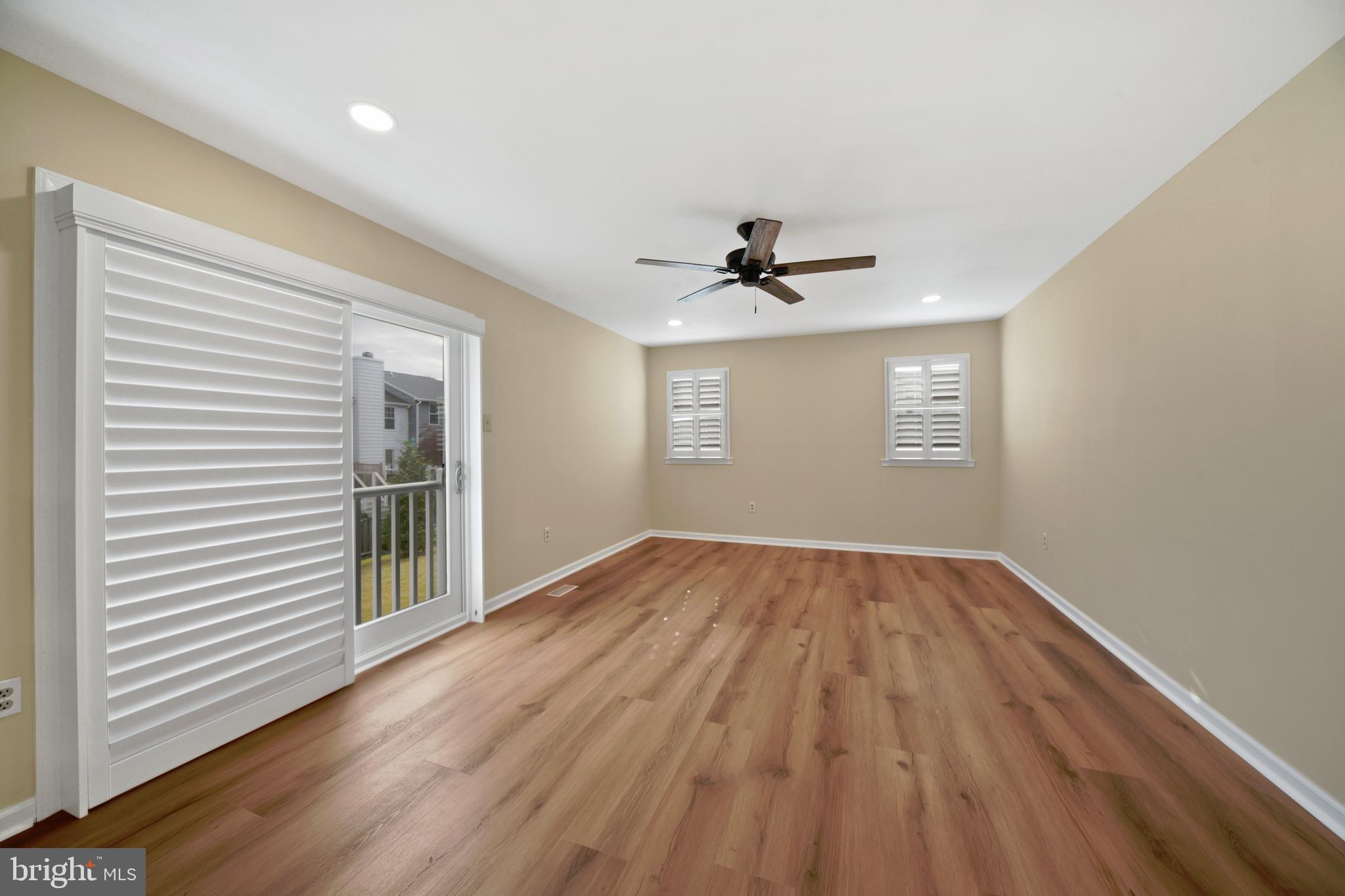 9729 Denrob Court Baltimore, MD 21234 - Photo 20 of 58 a view of empty room with wooden floor and fan
