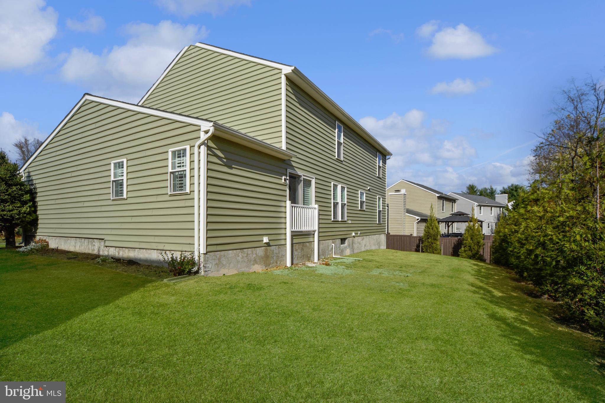 9729 Denrob Court Baltimore, MD 21234 - Photo 2 of 58 a backyard of a house with table and chairs