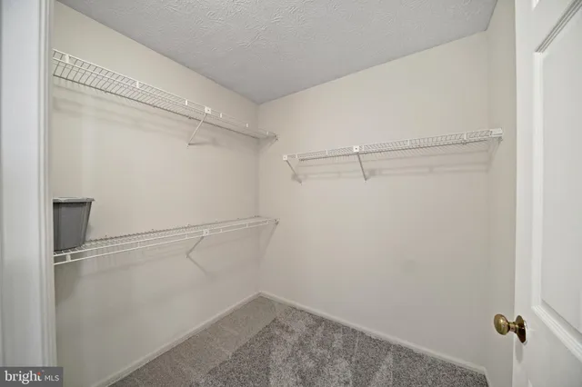 a bathroom with a toilet a sink and a mirror