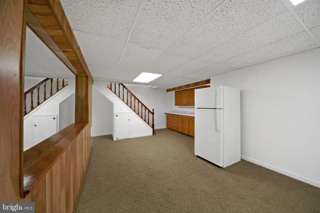 a view of an empty room with closet