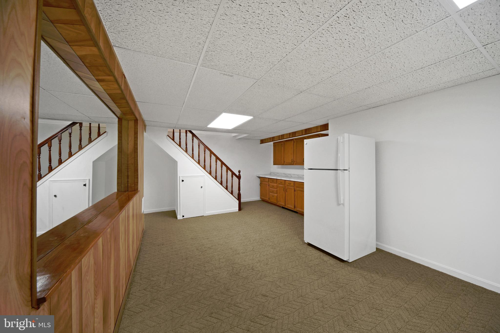 9729 Denrob Court Baltimore, MD 21234 - Photo 41 of 58 a view of a hallway with staircase
