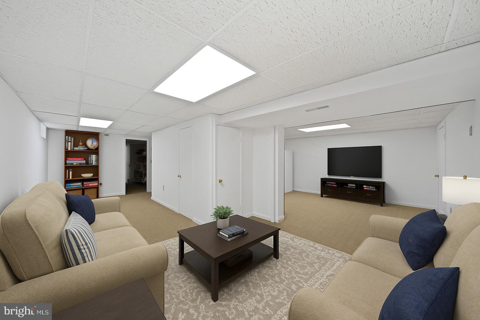 9729 Denrob Court Baltimore, MD 21234 - Photo 44 of 58 a living room with furniture and a flat screen tv