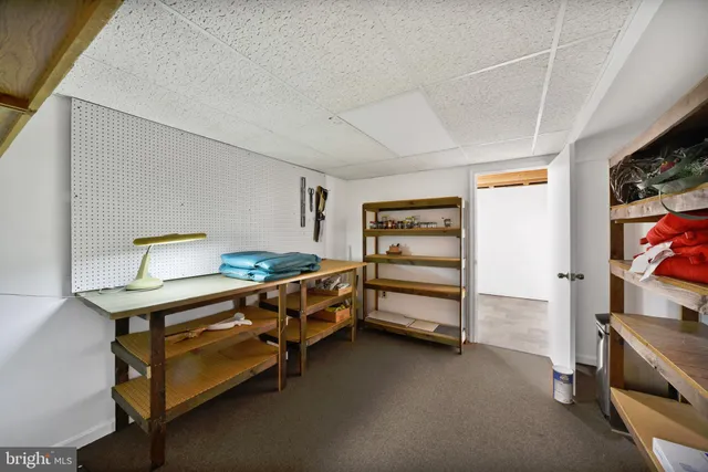 an aerial view of a house with yard swimming pool and outdoor seating