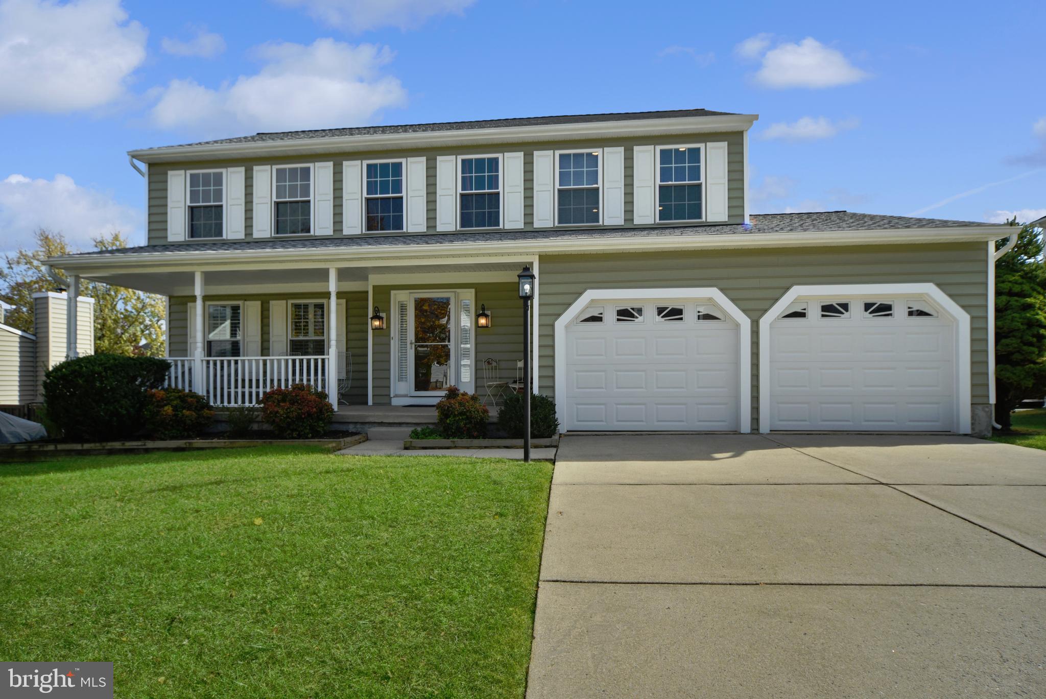 9729 Denrob Court Baltimore, MD 21234 - Photo 49 of 58 a front view of a house with a garden