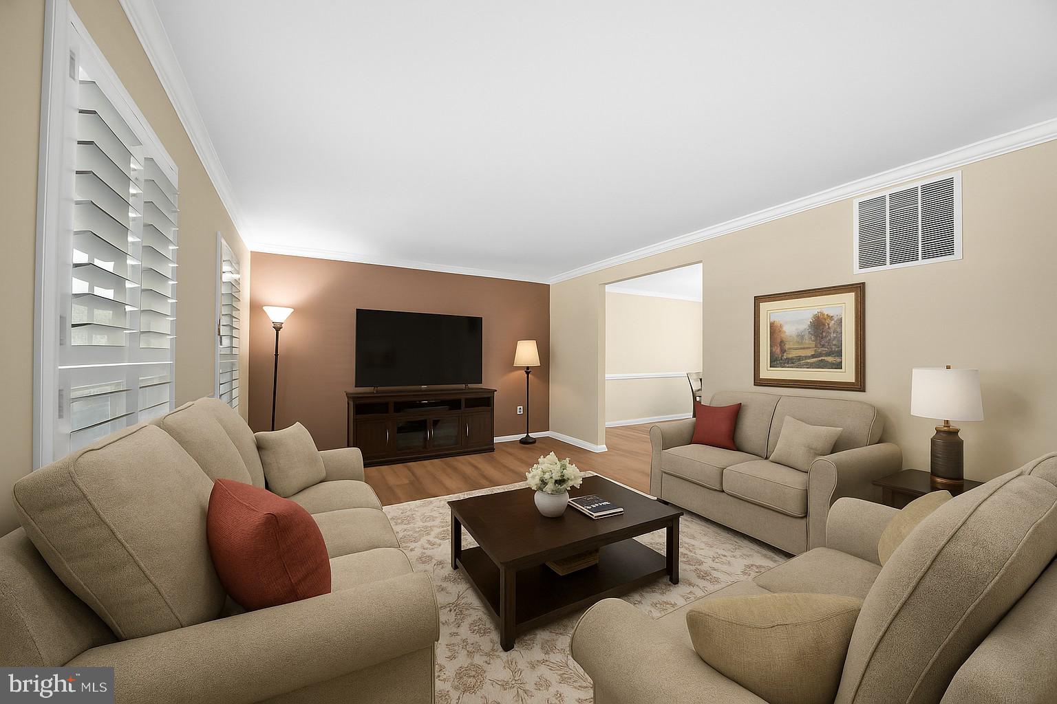 9729 Denrob Court Baltimore, MD 21234 - Photo 7 of 58 a living room with furniture and a flat screen tv