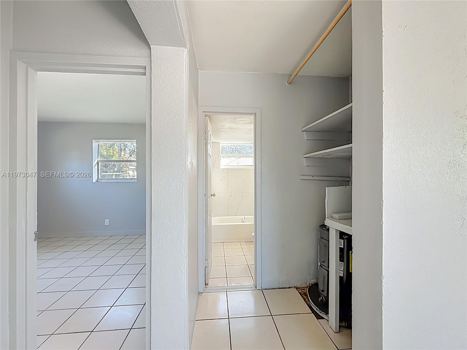2408 Northwest 8th Street Pompano Beach, FL 33069 - Photo 11 of 24 a view of an empty room and window