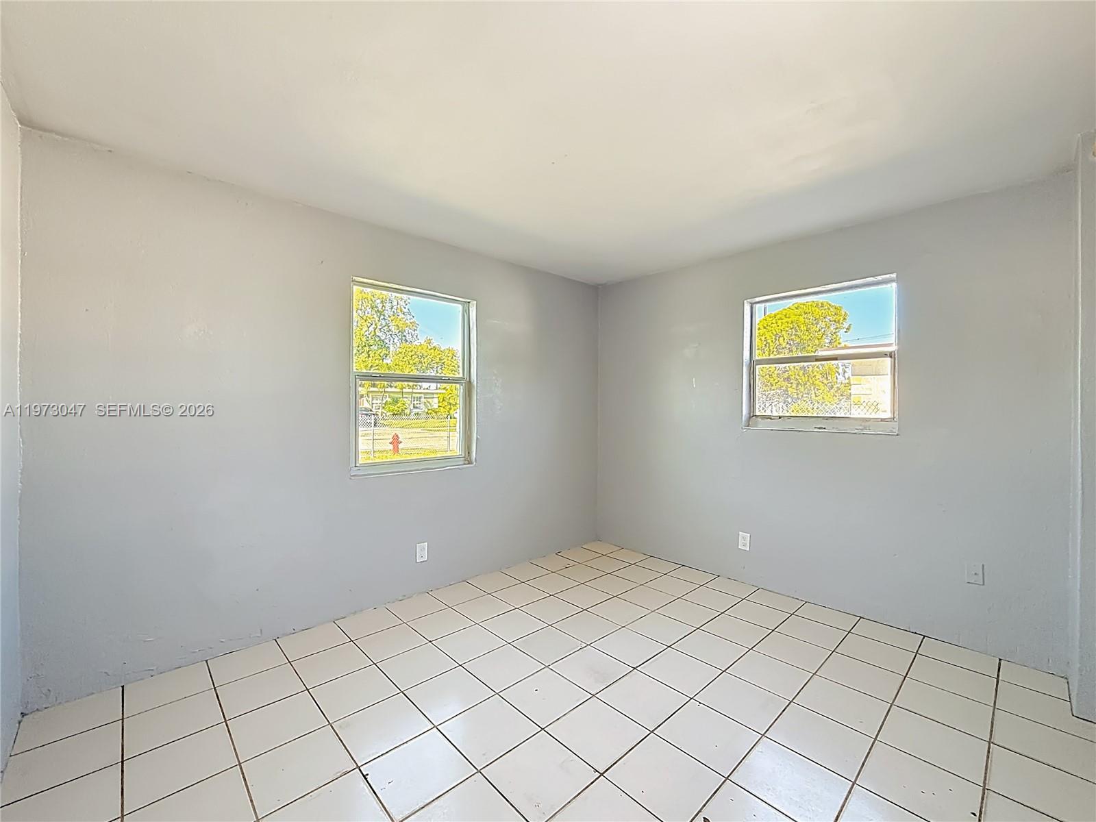 2408 Northwest 8th Street Pompano Beach, FL 33069 - Photo 12 of 24 a view of an empty room with window