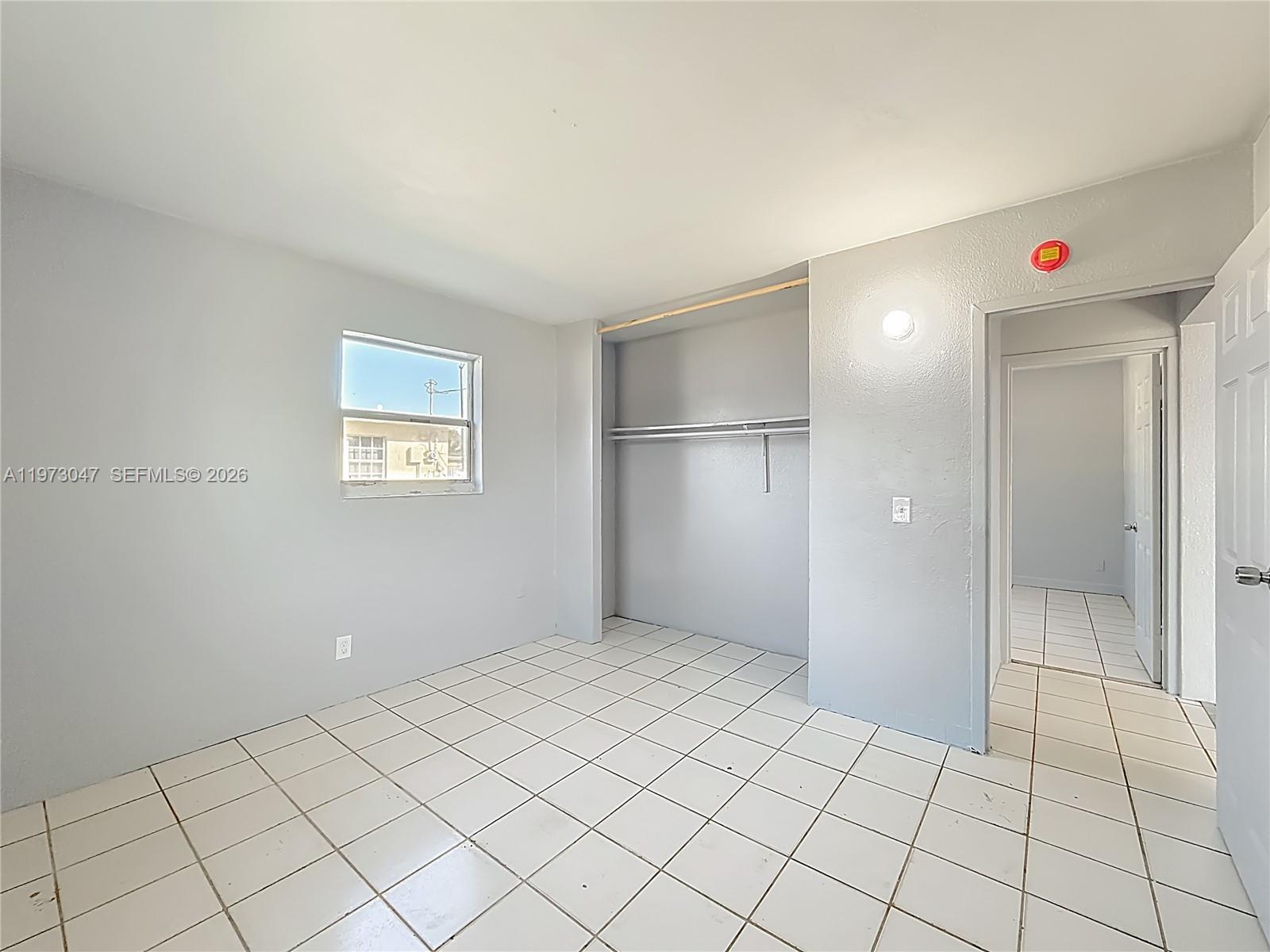 2408 Northwest 8th Street Pompano Beach, FL 33069 - Photo 13 of 24 a view of an empty room and window