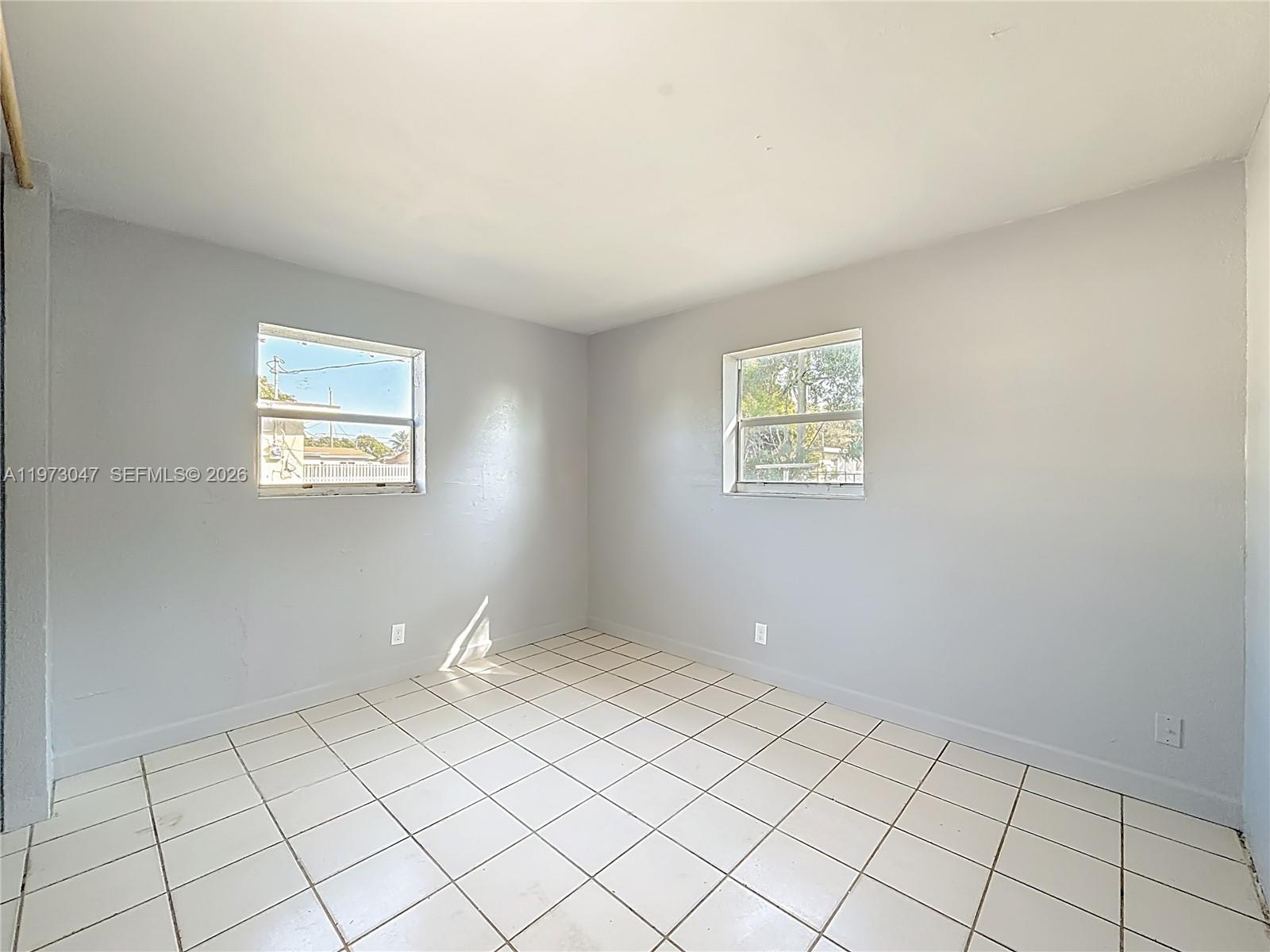 2408 Northwest 8th Street Pompano Beach, FL 33069 - Photo 16 of 24 a view of an empty room with window