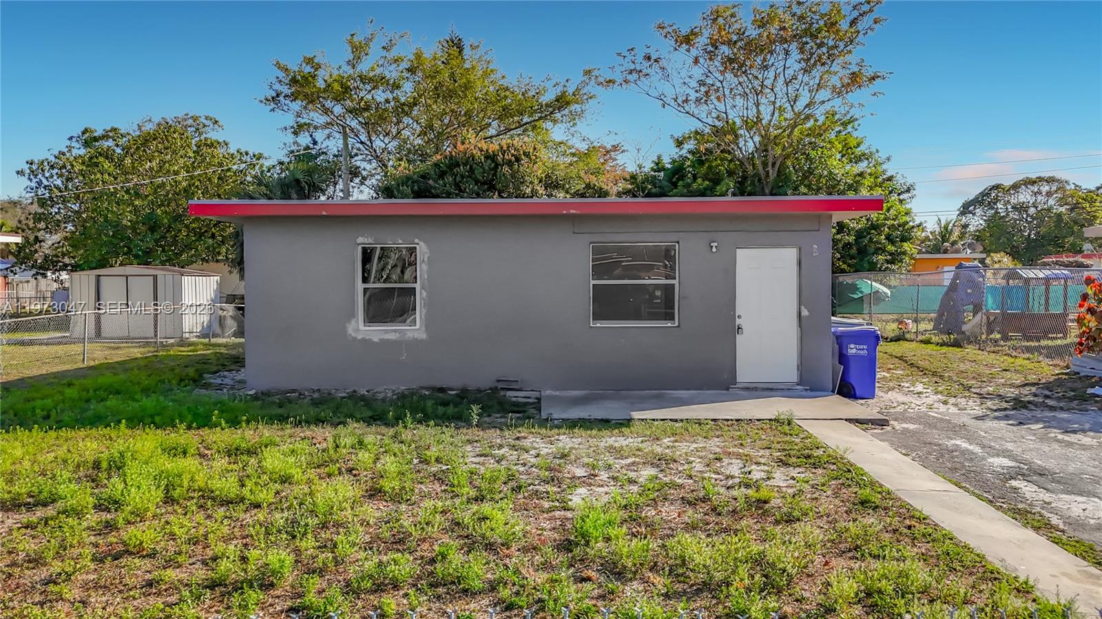 2408 Northwest 8th Street Pompano Beach, FL 33069 - Photo 9 of 24 a view of backyard of house with green space