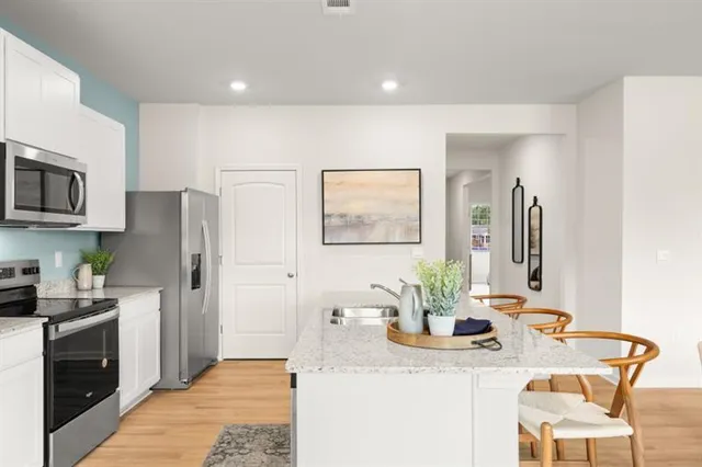 a view of a dining room with furniture and window