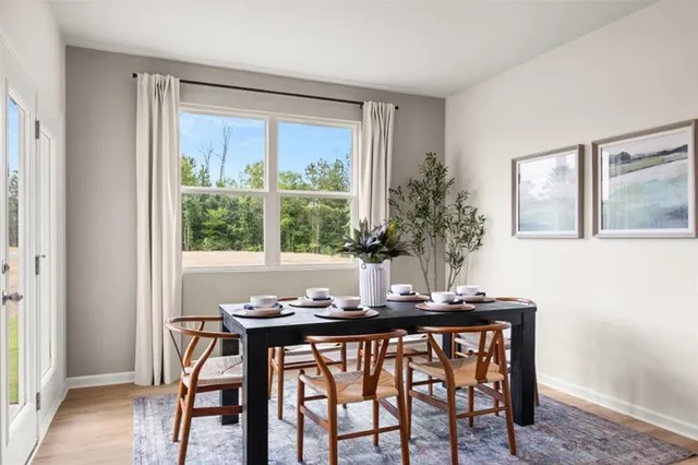a dining room with furniture and window