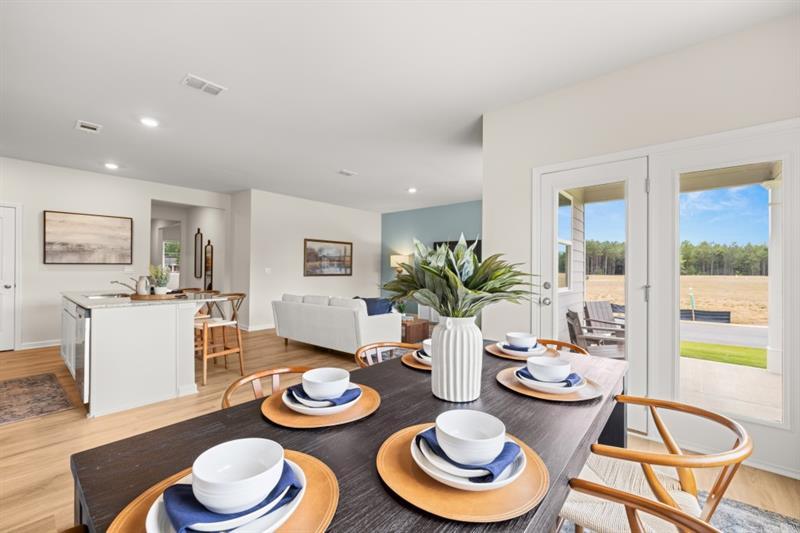 1 Babcock Drive Northeast Rome, GA 30165 - Photo 15 of 51 a dining room with furniture a rug and wooden floor