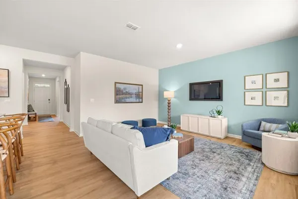 a living room with furniture and a window