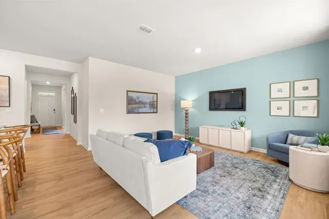 a living room with furniture and a window