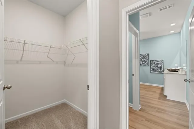a bathroom with a bathtub and a window