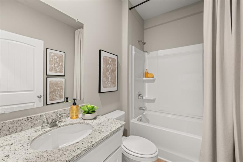 1 Babcock Drive Northeast Rome, GA 30165 - Photo 39 of 51 a bathroom with a granite countertop tub sink toilet and mirror