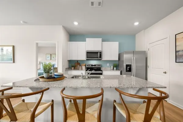 a kitchen with granite countertop a sink and a window
