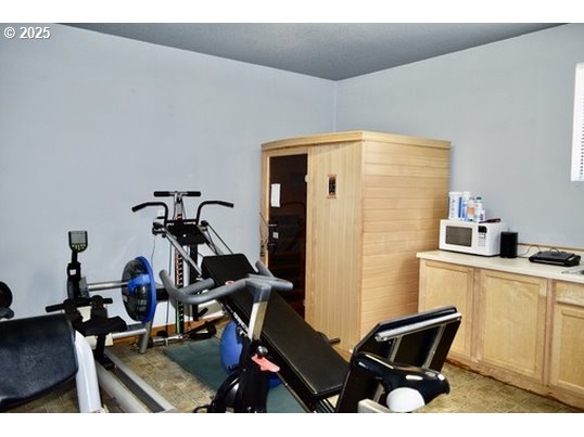 34518 Mutts Way Gold Beach, OR 97444 - Photo 20 of 40 a view of a workspace with furniture and a window