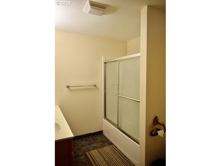 34518 Mutts Way Gold Beach, OR 97444 - Photo 21 of 40 a bathroom with a sink and a mirror