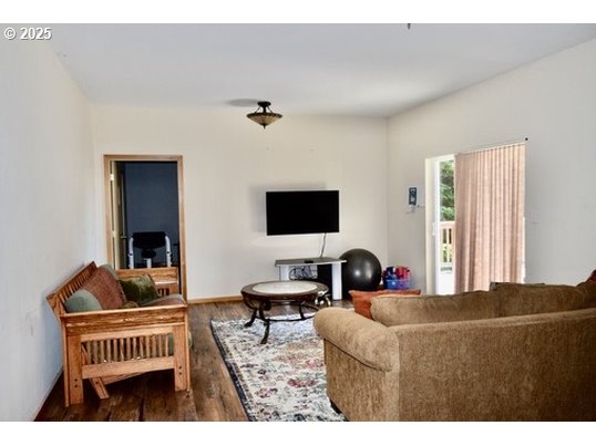 34518 Mutts Way Gold Beach, OR 97444 - Photo 25 of 40 a living room with furniture and a flat screen tv