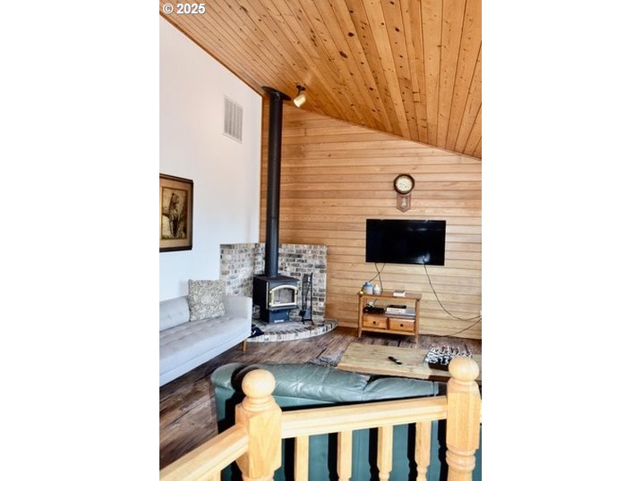 34518 Mutts Way Gold Beach, OR 97444 - Photo 28 of 40 a living room with furniture and a flat screen tv