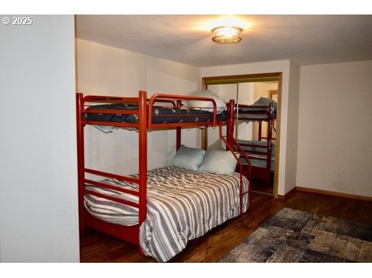 34518 Mutts Way Gold Beach, OR 97444 - Photo 30 of 40 a bedroom with a bed next to a window and closet