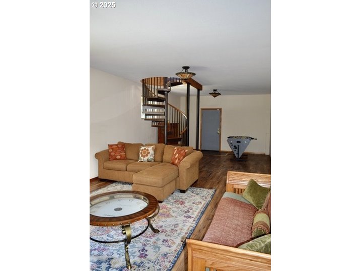 34518 Mutts Way Gold Beach, OR 97444 - Photo 35 of 40 a living room with furniture and a wooden floor