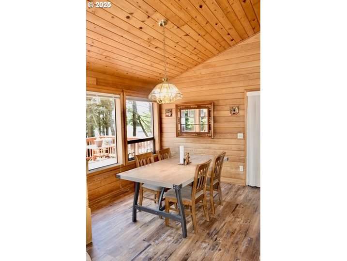 34518 Mutts Way Gold Beach, OR 97444 - Photo 40 of 40 a view of a dining room with furniture and wooden floor