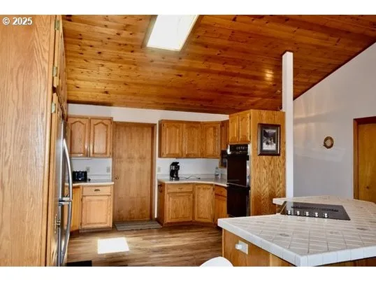 a kitchen view with appliances and cabinets