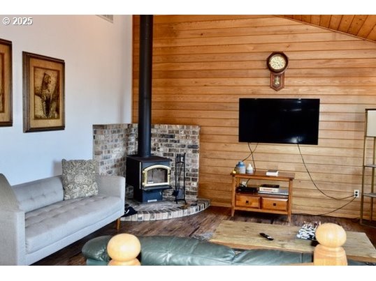 34518 Mutts Way Gold Beach, OR 97444 - Photo 8 of 40 a living room with furniture and a flat screen tv