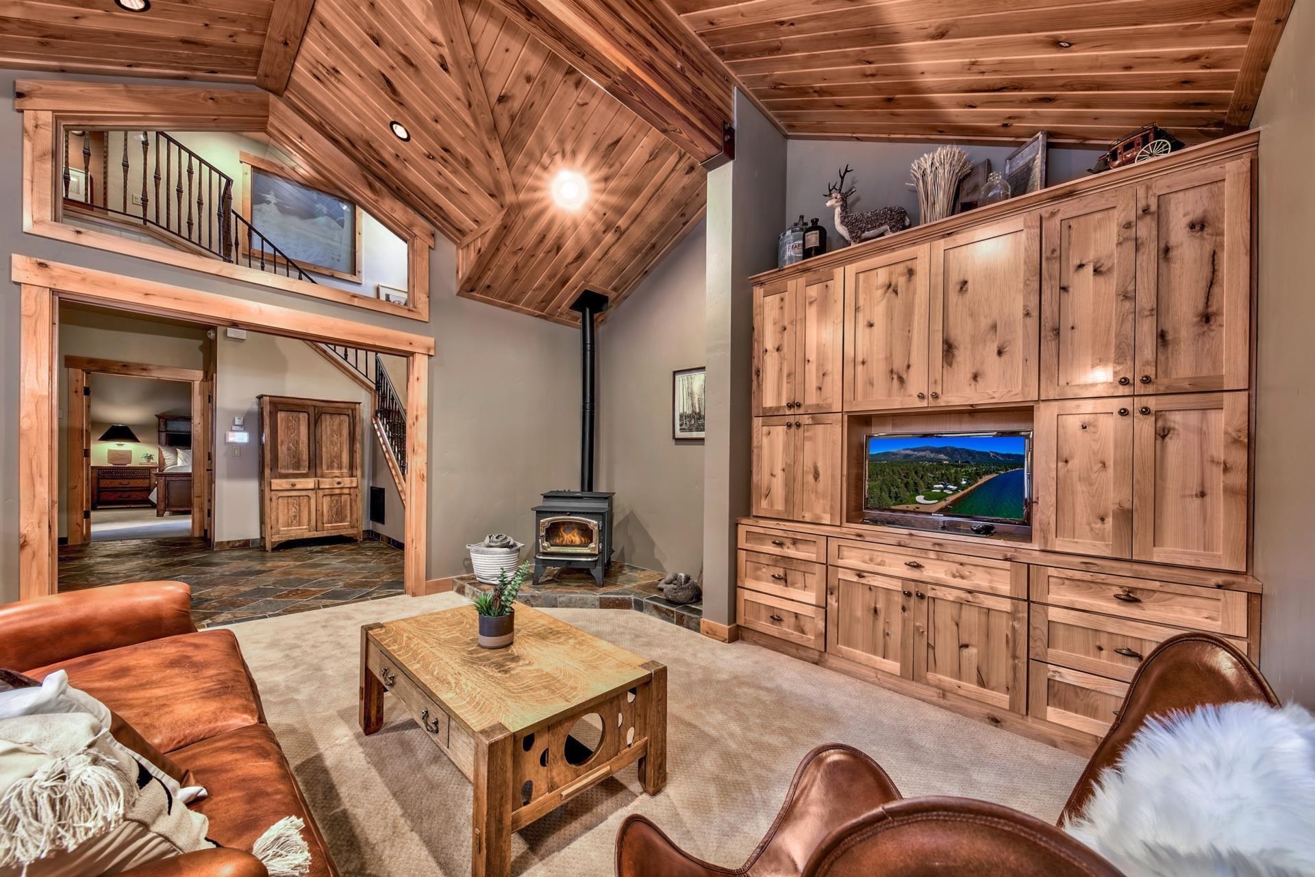 13970 Ski View Loop Truckee, CA 96161 - Photo 11 of 21 a view of living room kitchen with furniture and a fireplace