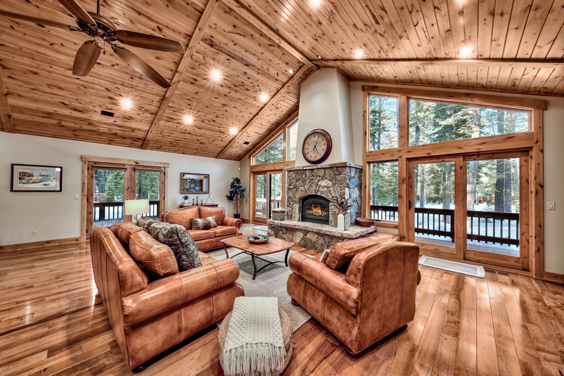 13970 Ski View Loop Truckee, CA 96161 - Photo 6 of 21 a living room with furniture a fireplace and a large window
