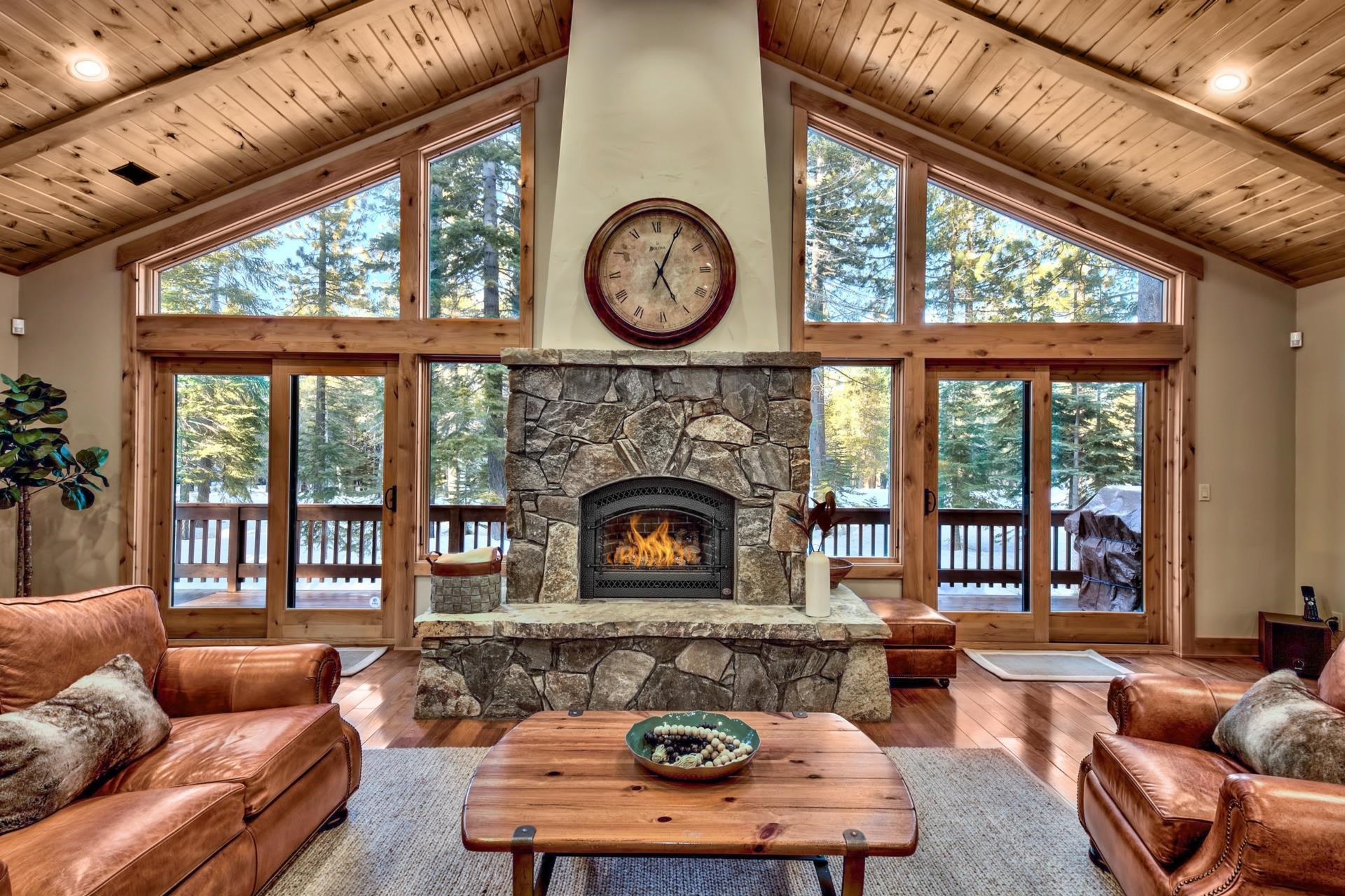 13970 Ski View Loop Truckee, CA 96161 - Photo 7 of 21 a living room with furniture a fireplace and a large window
